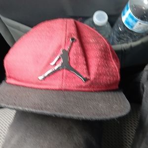 A red black and silver Jordan jumpman hat